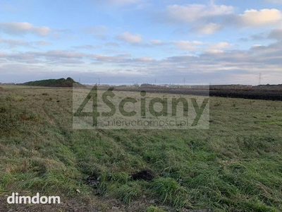 Działka budowlano - usługowa o łącznej powierzchni 9900 m2 ( 294 m x 32 m).