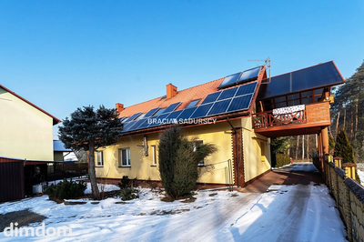 Dwa domy w otoczeniu Puszczy Niepołomickiej. - 2