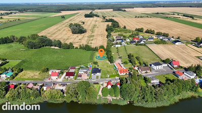 Urokliwa miejscowość nad jeziorem | działka z WZ - 4
